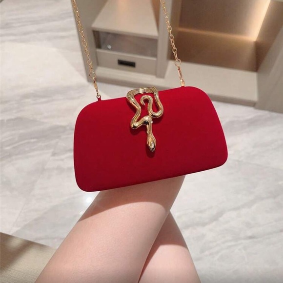 Elegant Red Clutch with Gold Snake Design  Accent